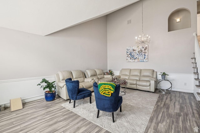 9355 S Peruvian Dr E, Sandy, UT 84093 - living area with wood finished floors and a chandelier