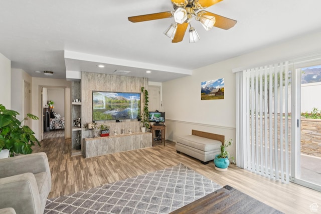 9355 S Peruvian Dr E, Sandy, UT 84093 - living room with wood finished floors, recessed lighting, and ceiling fan