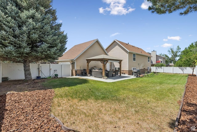 9355 S Peruvian Dr E, Sandy, UT 84093 - back of house with a gazebo, a fenced backyard, a patio, brick siding, and an outdoor living space