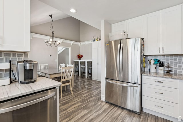 9355 S Peruvian Dr E, Sandy, UT 84093 - kitchen featuring stainless steel appliances, tasteful backsplash, white cabinetry, light stone counters, and recessed lighting