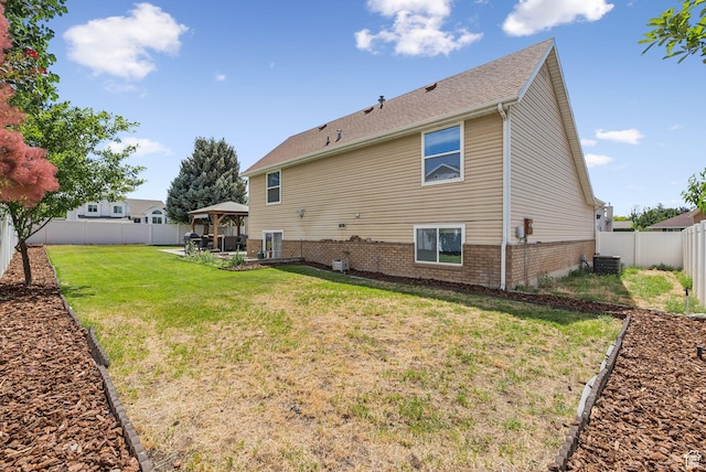 9355 S Peruvian Dr E, Sandy, UT 84093 - rear view of house featuring a gazebo, brick siding, a patio area, and a fenced backyard