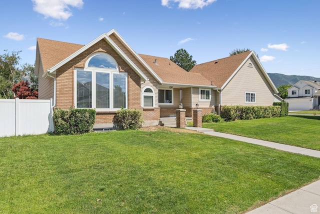 9355 S Peruvian Dr E, Sandy, UT 84093 - view of front of property with brick siding and roof with shingles