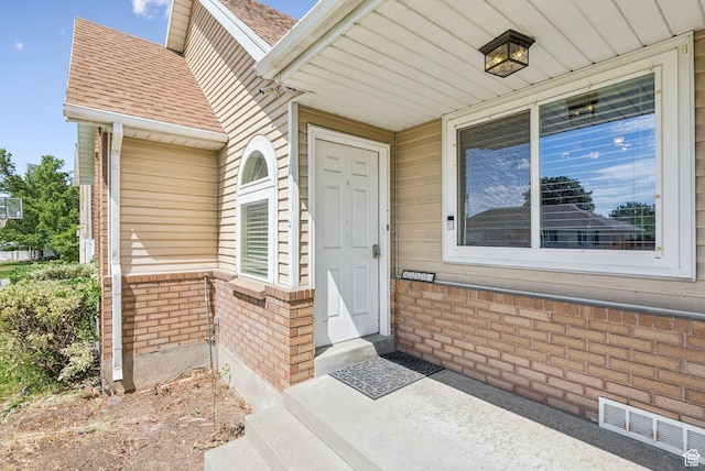 9355 S Peruvian Dr E, Sandy, UT 84093 - property entrance with brick siding and roof with shingles