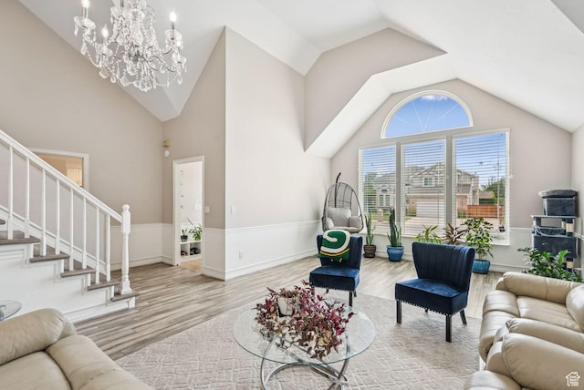9355 S Peruvian Dr E, Sandy, UT 84093 - living room featuring wood finished floors, a chandelier, stairway, and high vaulted ceiling
