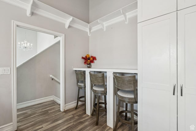 9355 S Peruvian Dr E, Sandy, UT 84093 - dining room featuring wood finished floors, a chandelier, and ornamental molding