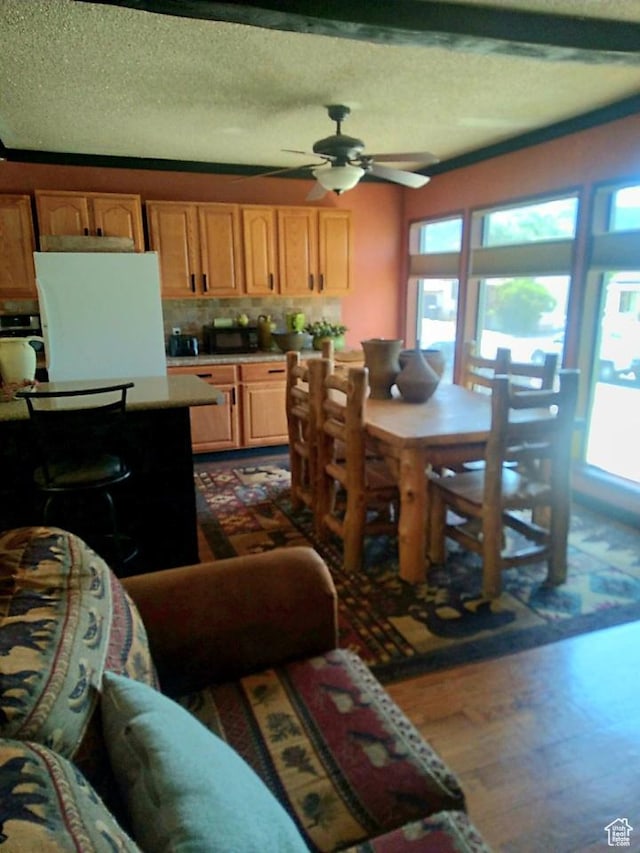 429 Edgehill Dr, Sunnyside, UT 84539 - living room with ceiling fan, dark wood-type flooring, and a textured ceiling