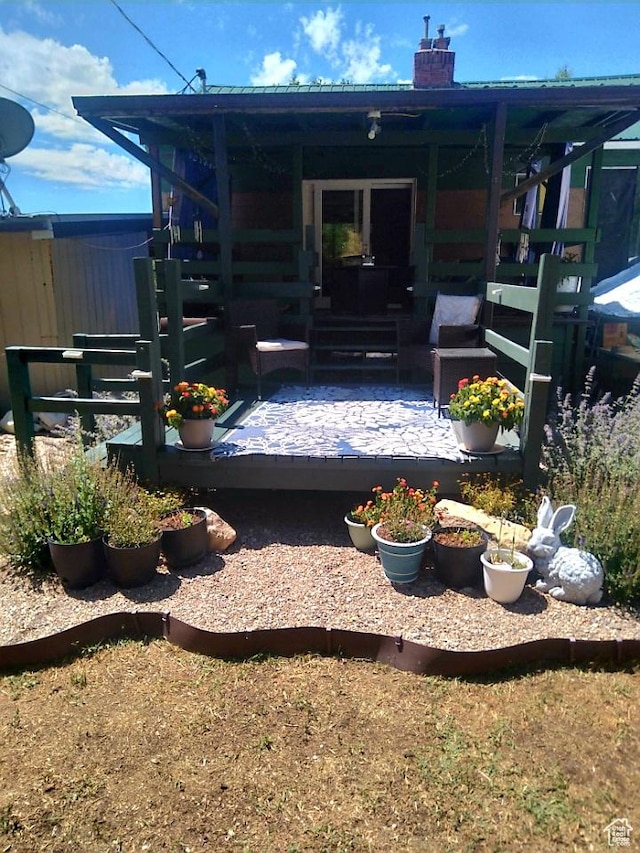 429 Edgehill Dr, Sunnyside, UT 84539 - back of property featuring a chimney, a patio, and an outdoor living space