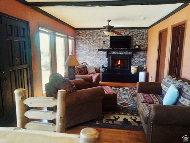 429 Edgehill Dr, Sunnyside, UT 84539 - living room with a ceiling fan, crown molding, a stone fireplace, and wood finished floors