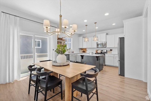 15181 S Sabre Pl, Bluffdale, UT 84065 - dining space with light wood-style flooring, a chandelier, and recessed lighting