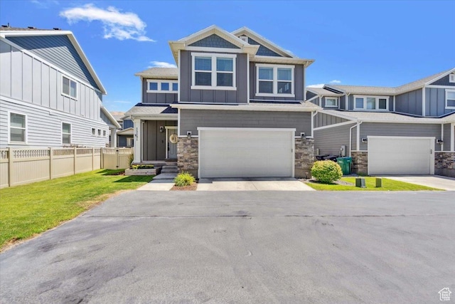 15181 S Sabre Pl, Bluffdale, UT 84065 - view of front of home featuring board and batten siding, stone siding, driveway, and a garage