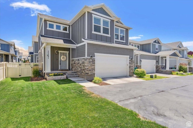 15181 S Sabre Pl, Bluffdale, UT 84065 - view of front of house with board and batten siding, an attached garage, a gate, stone siding, and a residential view