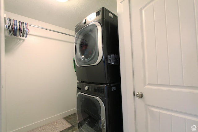 1464 W 800 S, Logan, UT 84321 - laundry area featuring stacked washer / drying machine and baseboards