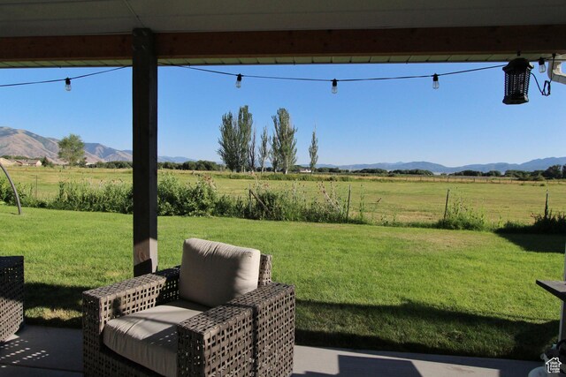 1464 W 800 S, Logan, UT 84321 - view of grassy yard with a rural view, a mountain view, and a patio area