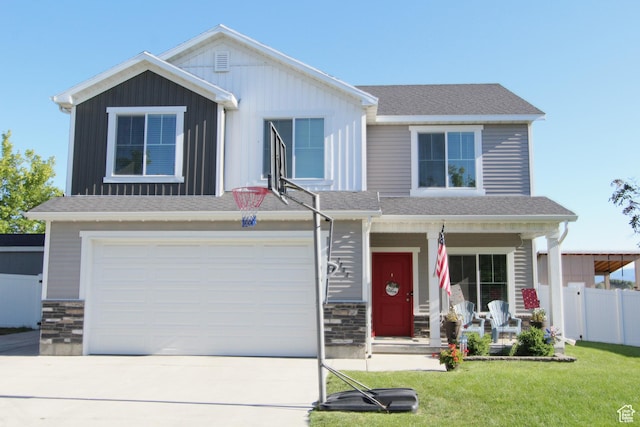 1464 W 800 S, Logan, UT 84321 - view of front of property with covered porch, driveway, stone siding, and a garage