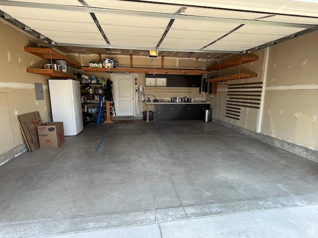 1464 W 800 S, Logan, UT 84321 - garage featuring a garage door opener and electric panel