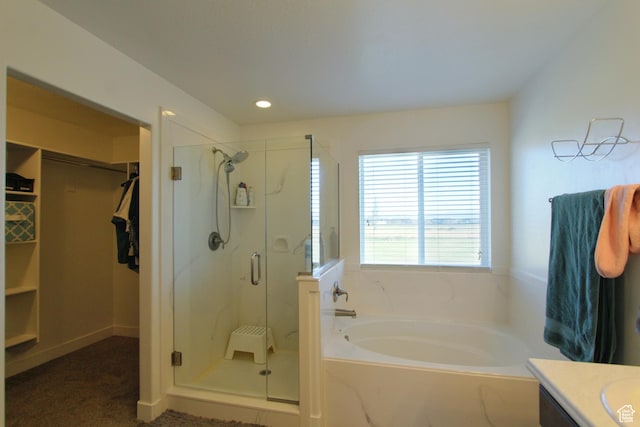 1464 W 800 S, Logan, UT 84321 - bathroom featuring a garden tub, a stall shower, vanity, a walk in closet, and recessed lighting