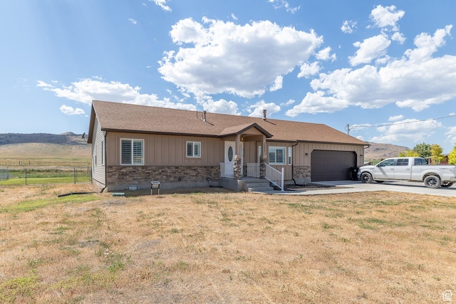 26551 N 8800 W, Portage, UT 84331 - single story home featuring stone siding, a garage, driveway, and board and batten siding