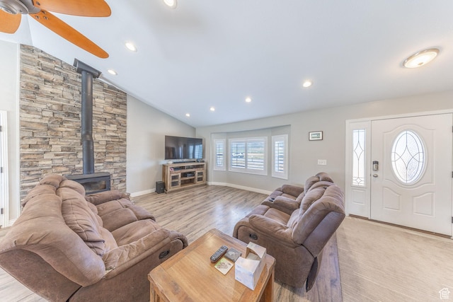26551 N 8800 W, Portage, UT 84331 - living area featuring a wood stove, ceiling fan, light wood-style floors, recessed lighting, and vaulted ceiling
