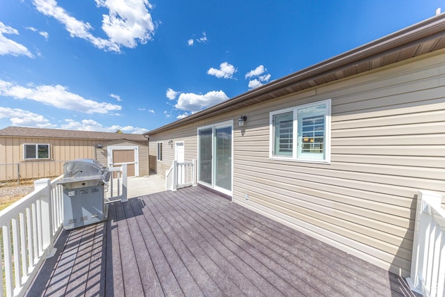 26551 N 8800 W, Portage, UT 84331 - wooden terrace featuring a grill and a storage unit