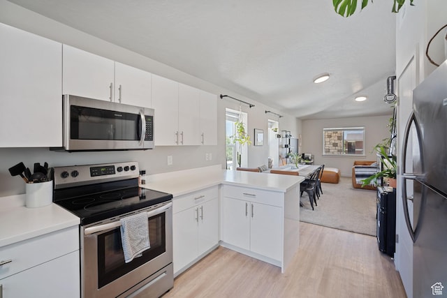 490 S 100 W Unit F305, Springville, UT 84663 - kitchen with stainless steel appliances, a peninsula, light wood finished floors, light countertops, and recessed lighting