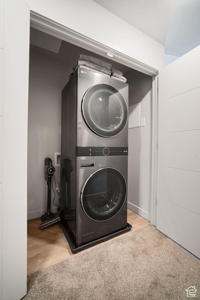490 S 100 W Unit F305, Springville, UT 84663 - laundry room featuring stacked washer and clothes dryer and wood finished floors