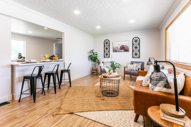 839 E Statice Ave S, Sandy, UT 84094 - living area featuring wood finished floors, ornamental molding, recessed lighting, and a textured ceiling
