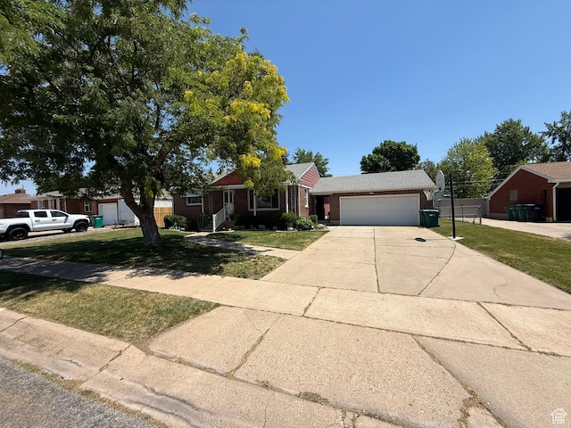 5140 S 2175 W, Roy, UT 84067 - single story home featuring a garage, concrete driveway, and a front lawn