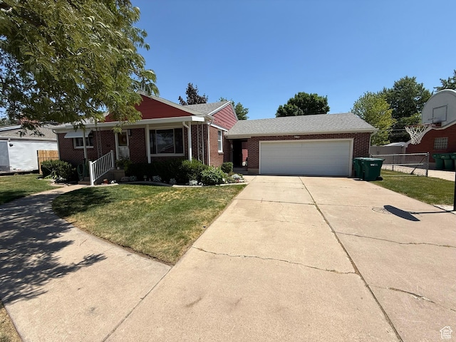 5140 S 2175 W, Roy, UT 84067 - view of front facade with brick siding, an attached garage, and concrete driveway