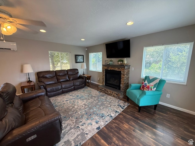 5140 S 2175 W, Roy, UT 84067 - living area featuring an AC wall unit, wood finished floors, a fireplace, ceiling fan, and recessed lighting