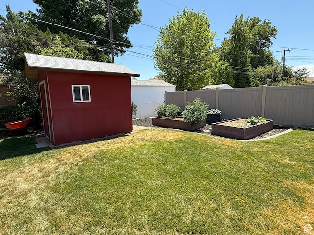 5140 S 2175 W, Roy, UT 84067 - view of yard featuring a vegetable garden and a shed