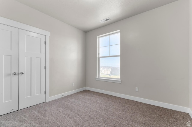 14643 S Mckellen Dr Unit D202, Herriman, UT 84096 - unfurnished bedroom featuring carpet flooring