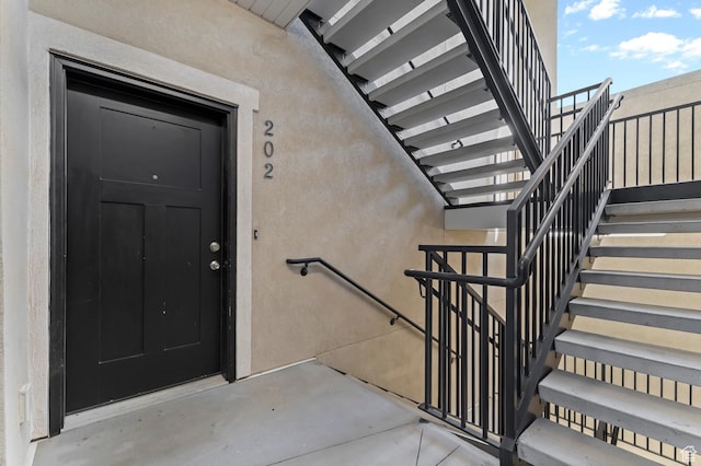 14643 S Mckellen Dr Unit D202, Herriman, UT 84096 - view of exterior entry with stucco siding