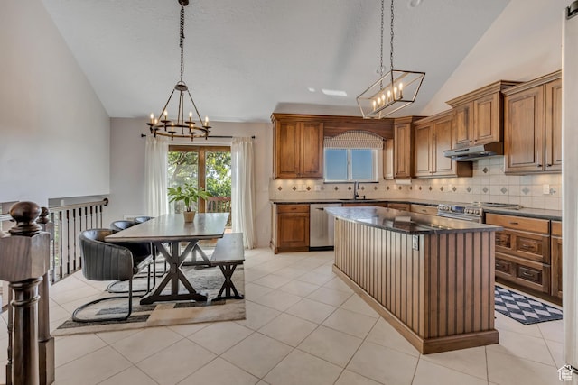 2140 E 3000 N, Layton, UT 84040 - kitchen with a chandelier, lofted ceiling, appliances with stainless steel finishes, backsplash, and brown cabinetry