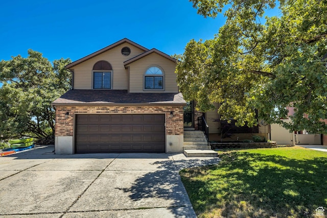 2140 E 3000 N, Layton, UT 84040 - traditional-style home featuring driveway, brick siding, a garage, a front yard, and a shingled roof