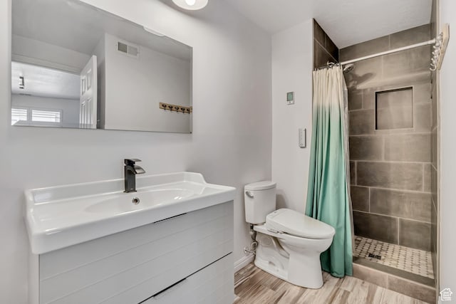 2140 E 3000 N, Layton, UT 84040 - full bath featuring vanity, a tile shower, and wood finished floors