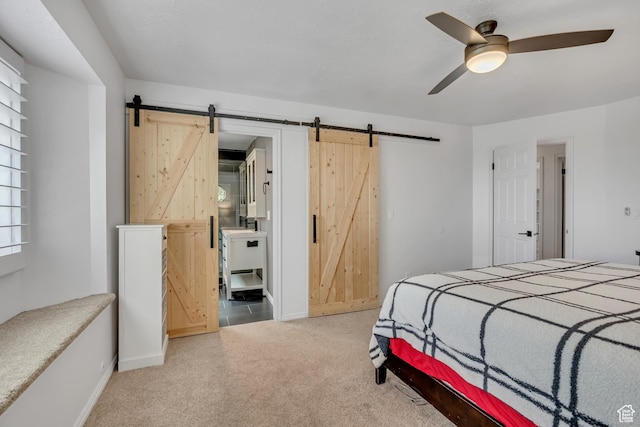 2140 E 3000 N, Layton, UT 84040 - bedroom with a barn door, light colored carpet, and a ceiling fan