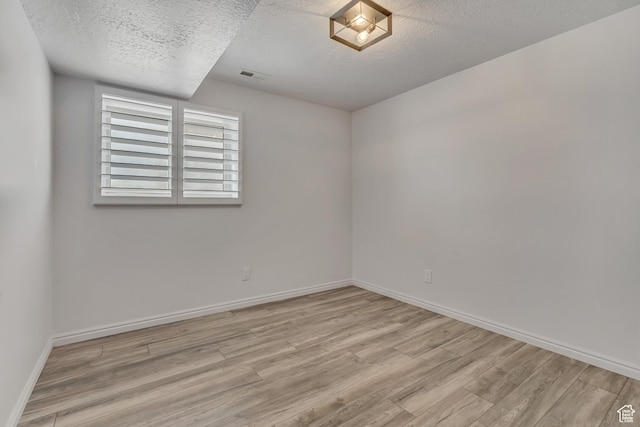 2140 E 3000 N, Layton, UT 84040 - empty room featuring wood finished floors and a textured ceiling