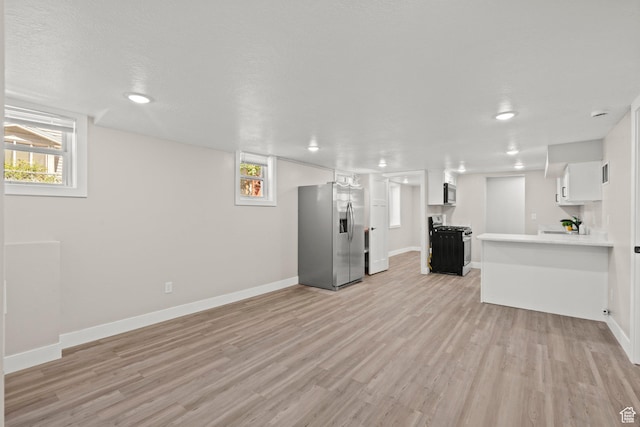 791 W 100 S, Provo, UT 84601 - unfurnished living room with light wood-style flooring and plenty of natural light