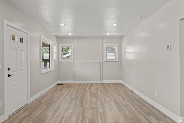 791 W 100 S, Provo, UT 84601 - spare room with light wood-style flooring, a textured ceiling, and a smoke detector