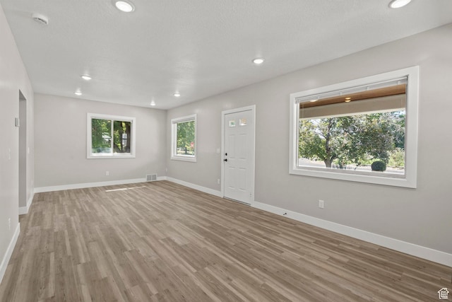 791 W 100 S, Provo, UT 84601 - unfurnished living room with light wood-style flooring and recessed lighting