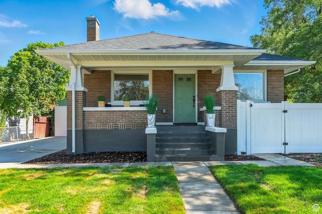 791 W 100 S, Provo, UT 84601 - view of front of property featuring brick siding, a gate, a porch, and a chimney