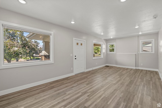 791 W 100 S, Provo, UT 84601 - unfurnished living room with light wood-style floors and recessed lighting