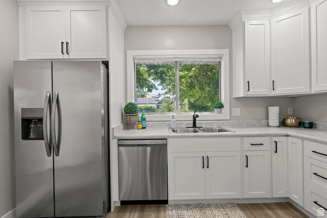 791 W 100 S, Provo, UT 84601 - kitchen featuring appliances with stainless steel finishes, white cabinets, light countertops, light wood-style floors, and recessed lighting