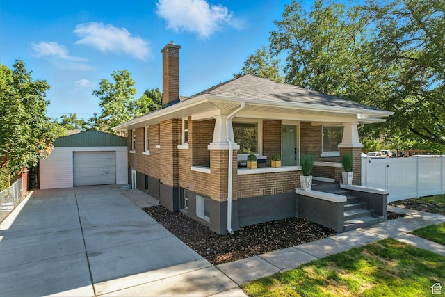 791 W 100 S, Provo, UT 84601 - view of front of home featuring an outbuilding, covered porch, brick siding, and driveway
