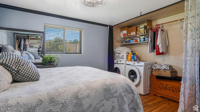 2075 Sorrento Dr, Woods Cross, UT 84087 - bedroom featuring washer and clothes dryer, wood finished floors, and crown molding