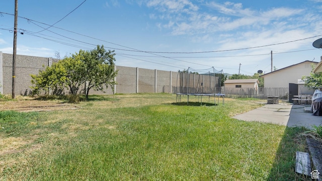 2075 Sorrento Dr, Woods Cross, UT 84087 - fenced backyard with a trampoline and a patio