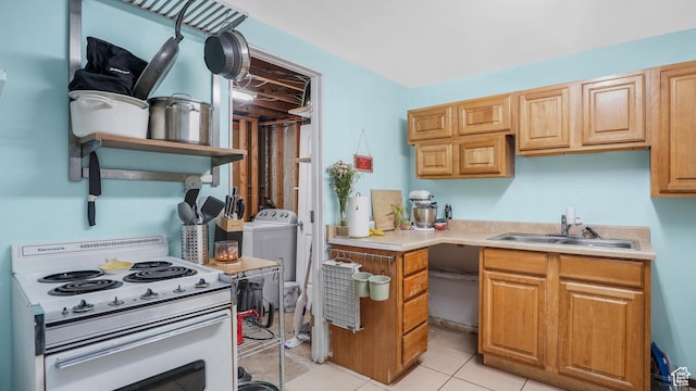 2075 Sorrento Dr, Woods Cross, UT 84087 - kitchen featuring white electric stove, light countertops, washer / clothes dryer, and light tile patterned floors