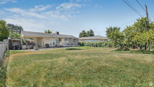 2075 Sorrento Dr, Woods Cross, UT 84087 - view of yard with a shed, a patio area, and a trampoline