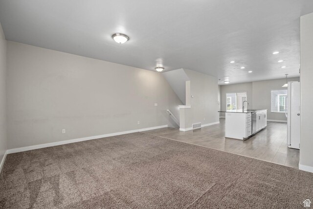 14728 S Rising Star Way W, Bluffdale, UT 84065 - unfurnished living room with light carpet and recessed lighting