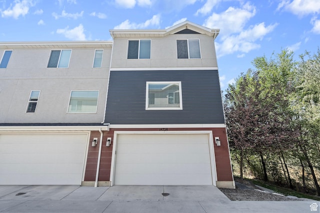 14728 S Rising Star Way W, Bluffdale, UT 84065 - view of front of home featuring an attached garage and driveway